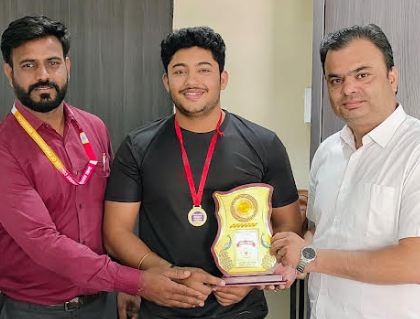 Shri Arihant College student Kanishk Singh Rajput won the gold medal in the division level weightlifting competition.